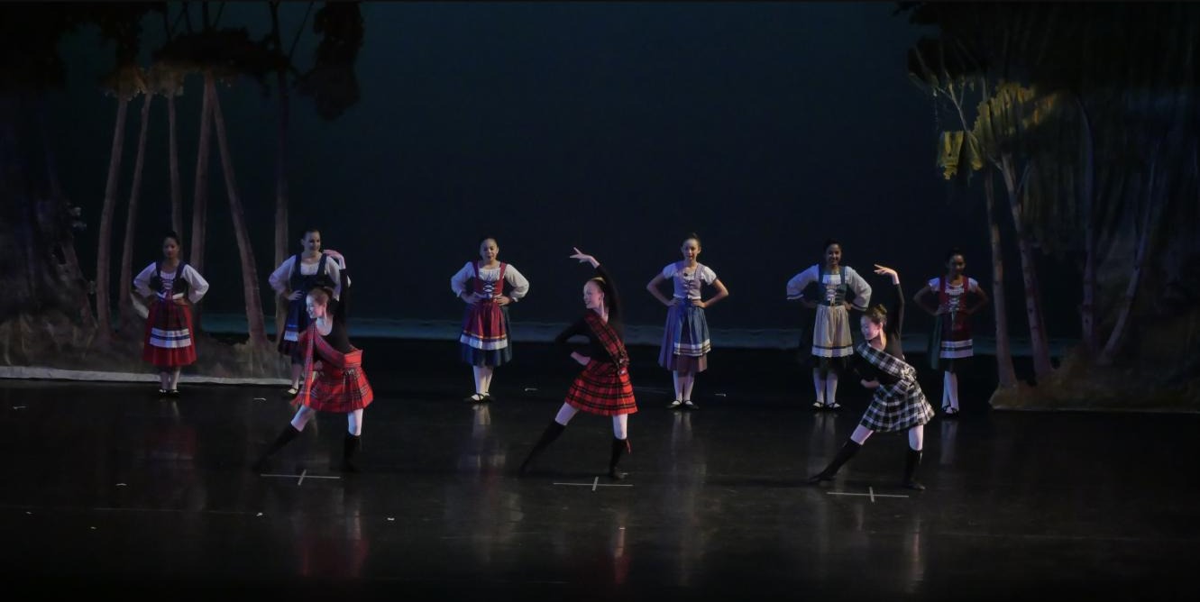 Valley Dance Theatre company dancers performing a full-cast production number on stage